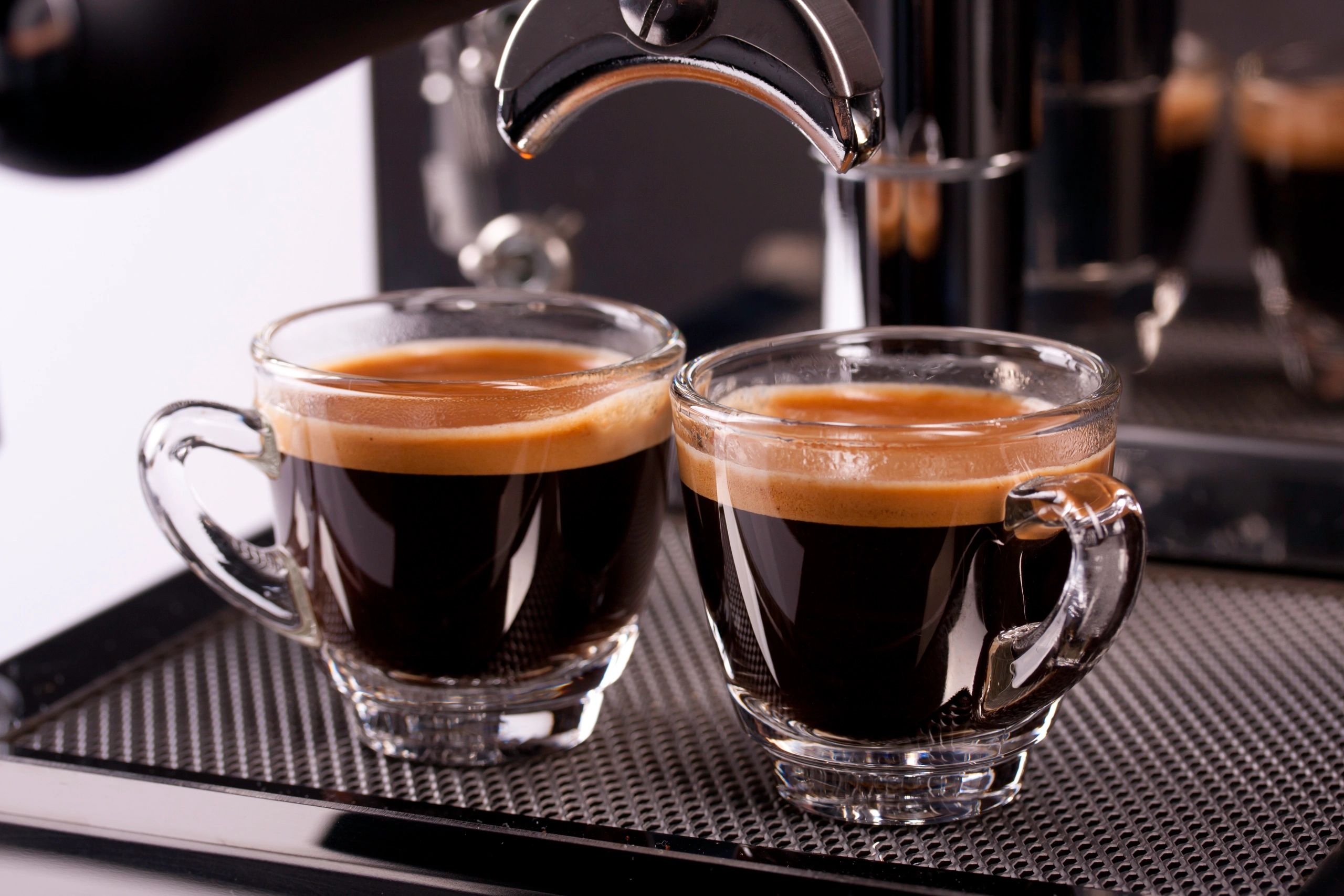 Two espresso shots with crema.
