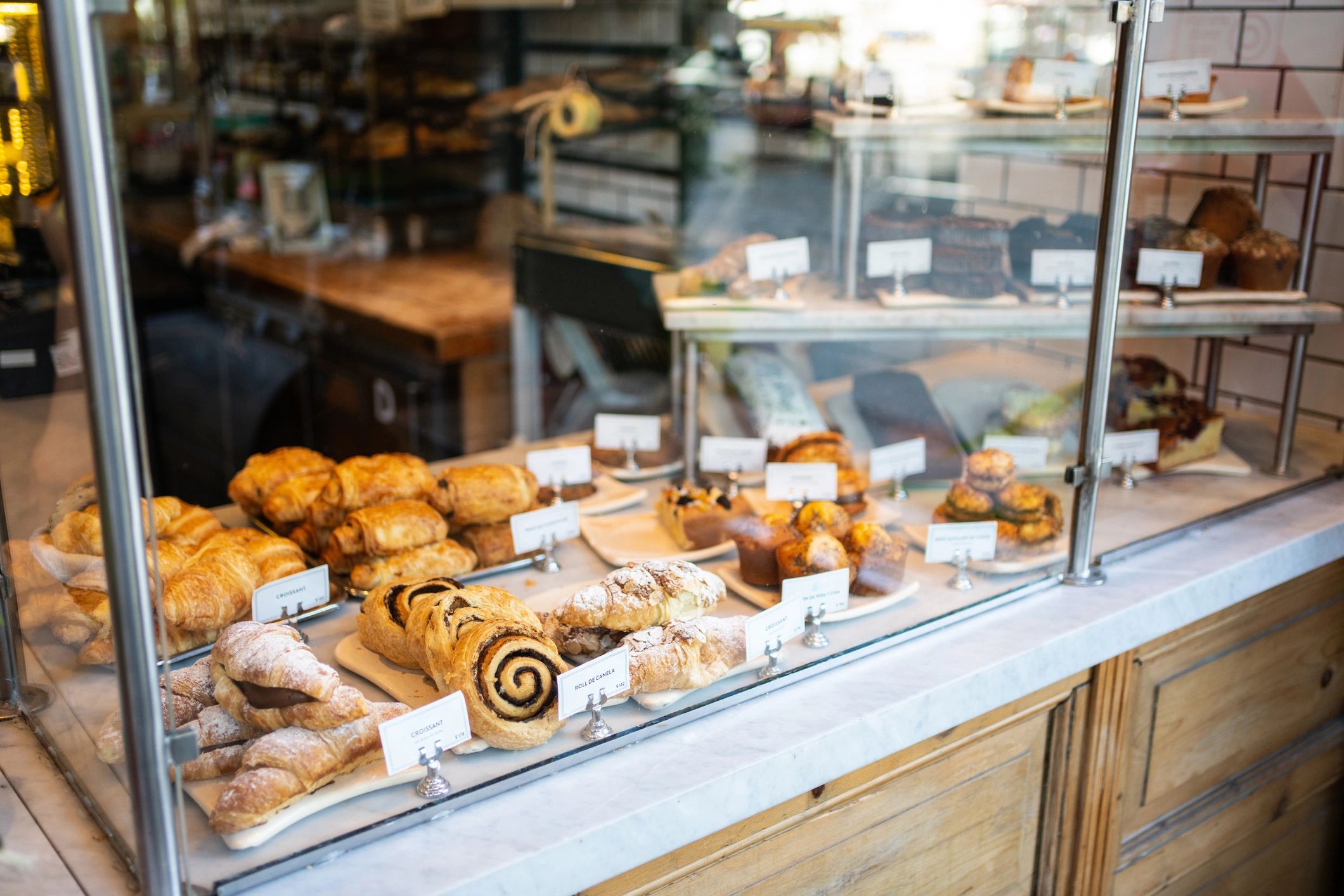 Pastries displayed in a glass cabinet.
